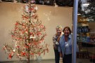 Artist Lynn Kishiyama and volunteer Carol Peterson are all smiles after finishing Studios holiday decorations