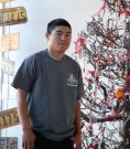 Cain Lopez with the Christmas tree